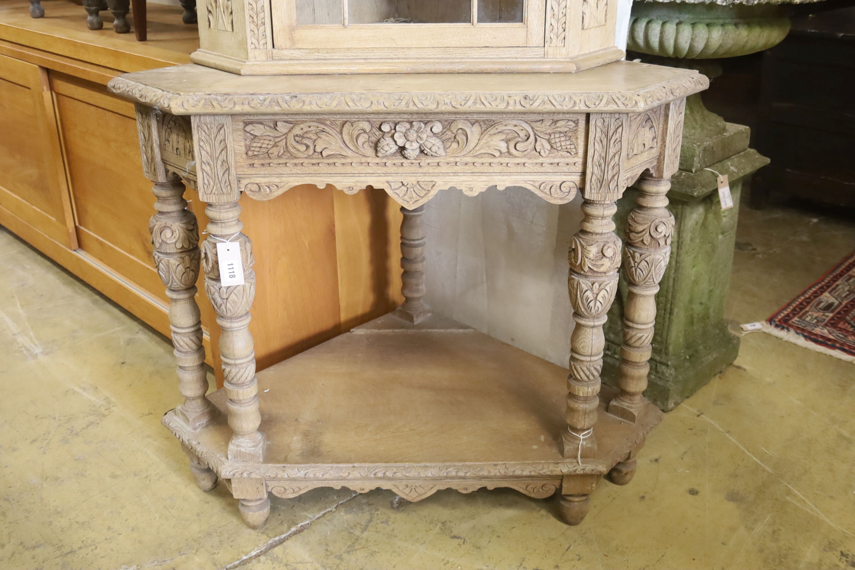 A Flemish bleached oak corner cabinet, width 98cm, depth 70cm, height 190cm
